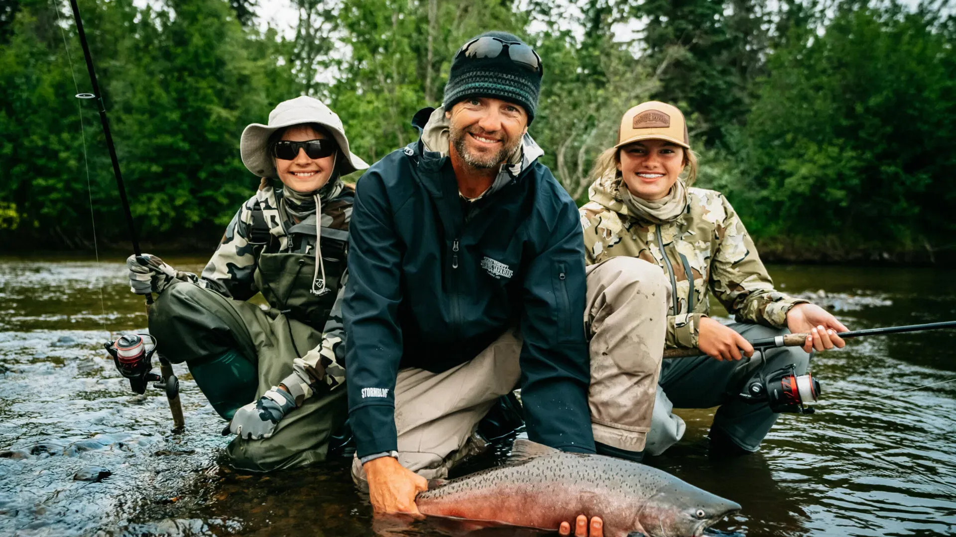 Family holding a King Salmon in the Mulchatna River